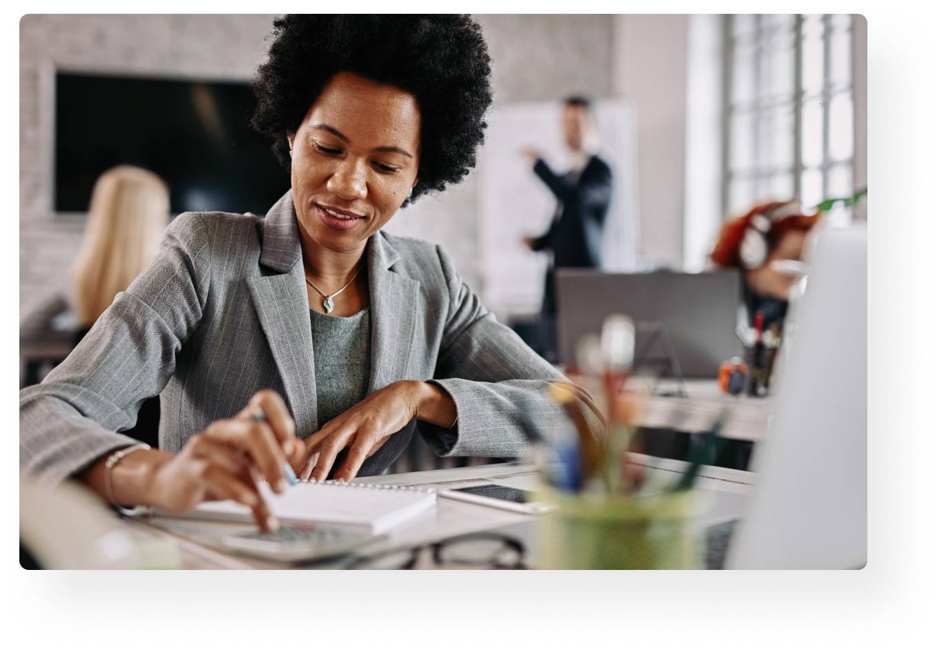 woman writing on notebook